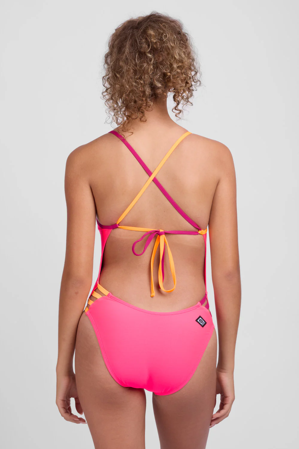 jolyn_womens_one-piece-swimsuit_train_gavin_hot-pink-multi_back1_1120x.jpg